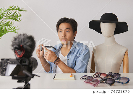 Asian Vlogger or Blogger Recording Video of Fashion Glasses Review 74725379