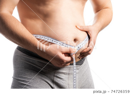Not a sports man man measures his waist with a centimeter Not a sports man man measures his waist with a centimeter 74726359