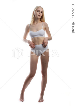 Sexy and sensual blonde woman with perfect body posing in studio isolated over white background with copyspace. Sexy and sensual blonde woman with perfect body posing in studio isolated over white background with copyspace. 74726491