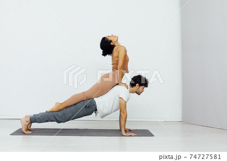 Man and woman paired family yoga asana gymnastics fitness 74727581