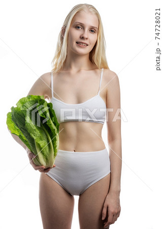 Smiling pretty child with healthy raw vegetables in hands. Organic natural healthy food produce. Smiling pretty child with healthy raw vegetables in hands. Organic natural healthy food produce. 74728021