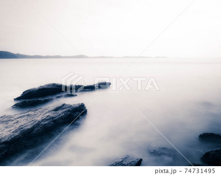 Long Exposure of Sea with Smooth Wave and Rock landscape. Nature of Seascape vacation holiday season time for relax travel Long Exposure of Sea with Smooth Wave and Rock landscape. Nature of Seascape vacation holiday season time for relax travel 74731495