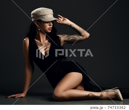 Gorgeous woman with pouty lips and tattoo on body 74733362