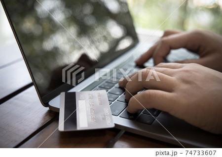 Businessman use laptop register via credit cards to make online purchases, Using the Internet in Online Marketing and Trading, Online shopping or Internet technology concept. 74733607