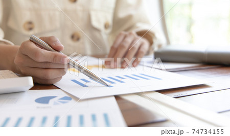 Financial businessmen analyze the graph of the company's performance to create profits and growth, Market research reports and income statistics, Financial and Accounting concept. Financial businessmen analyze the graph of the company's performance to create profits and growth, Market research reports and income statistics, Financial and Accounting concept. 74734155