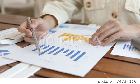 Financial businessmen analyze the graph of the company's performance to create profits and growth, Market research reports and income statistics, Financial and Accounting concept. Financial businessmen analyze the graph of the company's performance to create profits and growth, Market research reports and income statistics, Financial and Accounting concept. 74734156