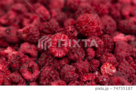 Heap of freeze dried raspberries close-up or dehydrated food background Heap of freeze dried raspberries close-up or dehydrated food background 74735187