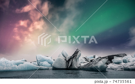 Northern lights aurora borealis over Jokulsarlon glacier ice lagoon in Iceland 74735561