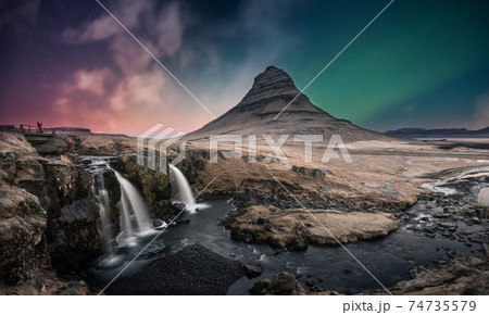 Northern lights aurora borealis over kirkjufell waterfall in Iceland Northern lights aurora borealis over kirkjufell waterfall in Iceland 74735579