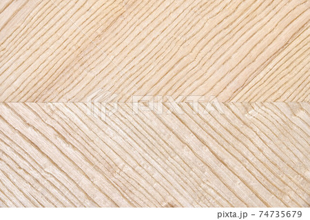 Wooden panel of ash veneer with stylish herringbone texture Wooden panel of ash veneer with stylish herringbone texture 74735679