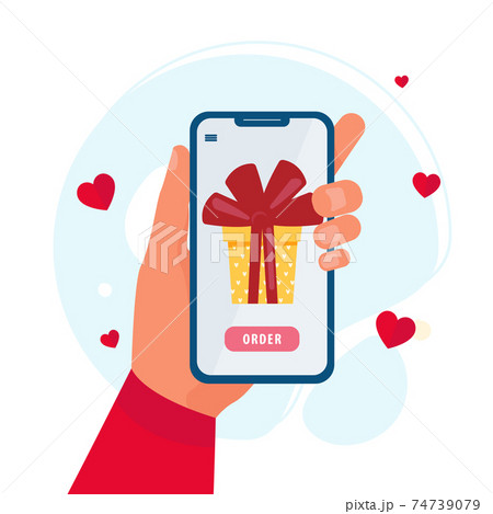 Smartphone in a hand with gift on screen. The concept of online shopping Smartphone in a hand with gift on screen. The concept of online shopping 74739079