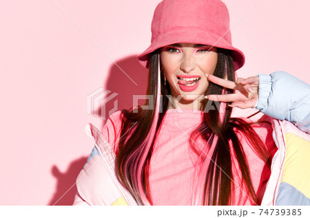Funky cool fashion model girl posing with victory Funky cool fashion model girl posing with victory 74739385
