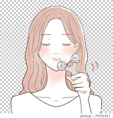 A woman who massages her face with a facial roller 74742421