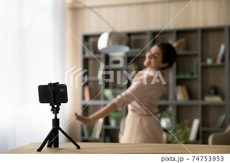 Close up of smartphone shoot woman dancing at home 74753953