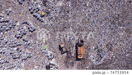 Bird's eye view of a garbage dump where machinery equals mountains of household waste, Ukraine. Ecological problem Bird's eye view of a garbage dump where machinery equals mountains of household waste, Ukraine. Ecological problem 74753954