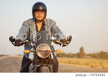 Young man riding big bike motocycle on asphalt high way against, Motorbike man has freedom 74754285