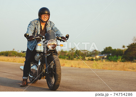 Young man riding big bike motocycle on asphalt high way against, Motorbike man has freedom 74754286