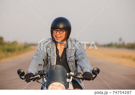 Young man riding big bike motocycle on asphalt high way against, Motorbike man has freedom 74754287