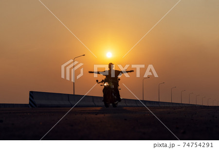 Young man riding big bike motocycle on asphalt high way against, Motorbike man has freedom 74754291