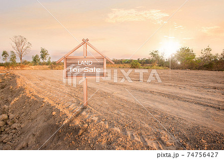 Land sales sign, land plot for housing construction project with car tire print in rural area and real estate sale or property investment concept, Land sales sign, land plot for housing construction project with car tire print in rural area and real estate sale or property investment concept, 74756427