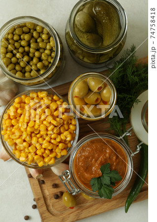 Different pickled food and ingredients on white textured background Different pickled food and ingredients on white textured background 74758418