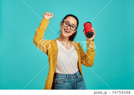 Young woman listens to music, positive emotion Young woman listens to music, positive emotion 74759396