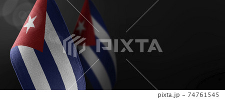 Small national flags of the Cuba on a dark background Small national flags of the Cuba on a dark background 74761545