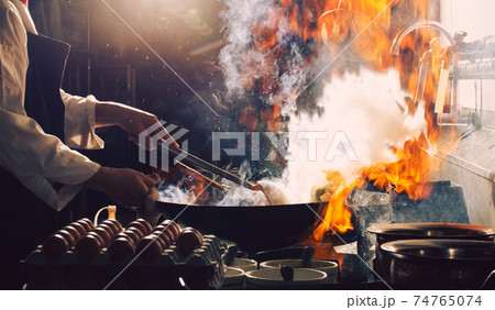 Chef is stirring food Chef is stirring food 74765074