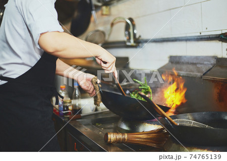 Stir fry cooking with chef Stir fry cooking with chef 74765139