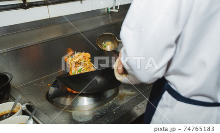 Chef stir fry cooking Chef stir fry cooking 74765183
