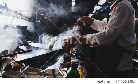 Chef stir fry cooking 74765186