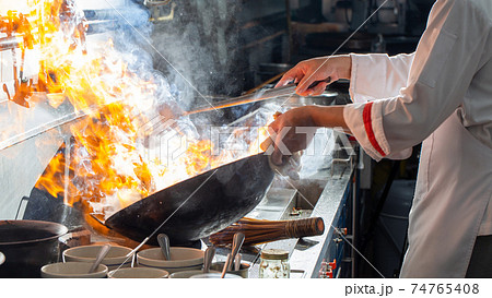Chef stir fry cooking 74765408