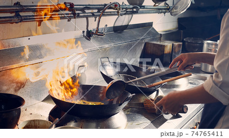 Chef stir fry cooking Chef stir fry cooking 74765411