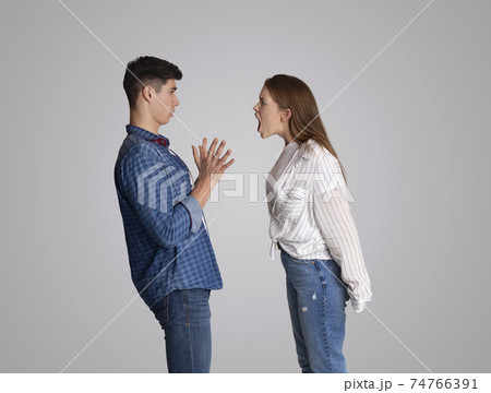 Stressed young married family couple arguing emotionally, blaming at husband 74766391