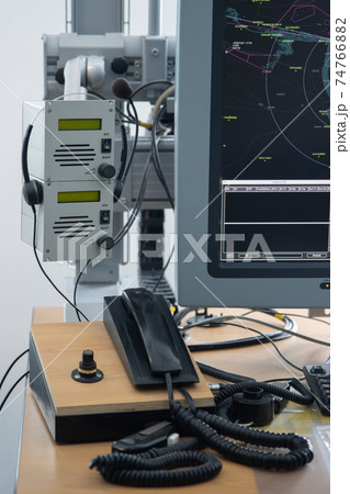 A navigation room and the workplace with phone in the airport A navigation room and the workplace with phone in the airport 74766882