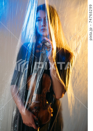 defocused musician woman self isolation lockdown 74768299