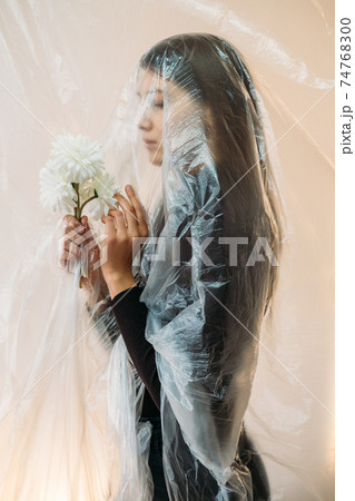 defocused profile portrait sad woman air pollution 74768300