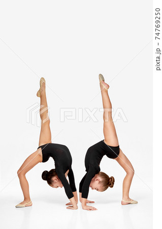 two flexible gymnast child girl show athletic skill two flexible gymnast child girl show athletic skill 74769250