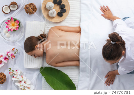 Woman at spa thai massage Woman at spa thai massage 74770781