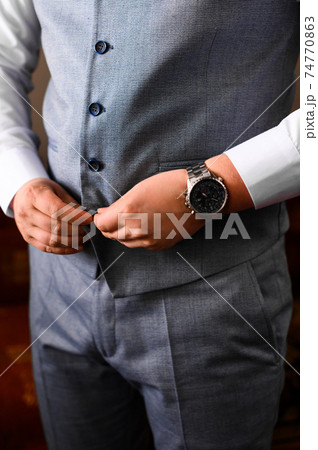 Groom's morning, details and husband's meeting on the wedding day. 74770863