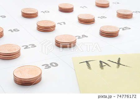 Euro money tax planning budget household utilities calendar tax accounting. Word tax written on yellow paper note with euro coins stacks on last day of month calendar pay taxes and budget calculation Euro money tax planning budget household utilities calendar tax accounting. Word tax written on yellow paper note with euro coins stacks on last day of month calendar pay taxes and budget calculation 74776172