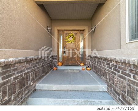 Pumpkins and wreath decoration for autumn in the shade 74777159