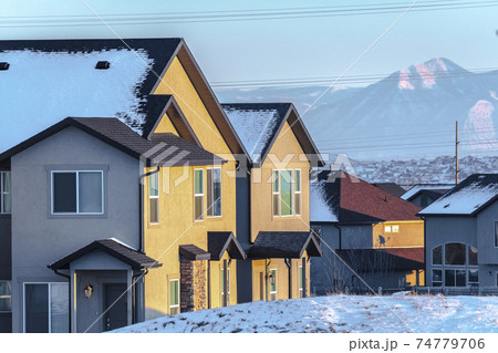 Traditional American houses in winter day light Traditional American houses in winter day light 74779706