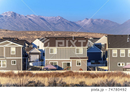 Traditional American two story houses in valley Traditional American two story houses in valley 74780492