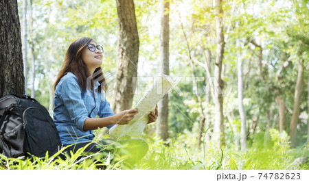 Happy hipster asian tourist travel in Asia backpack with smiling face and happiness laugh 74782623