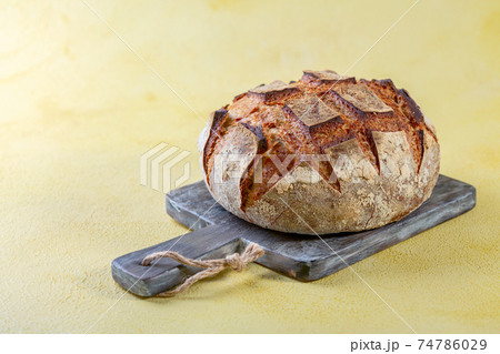Freshly baked artisanal bread. 74786029