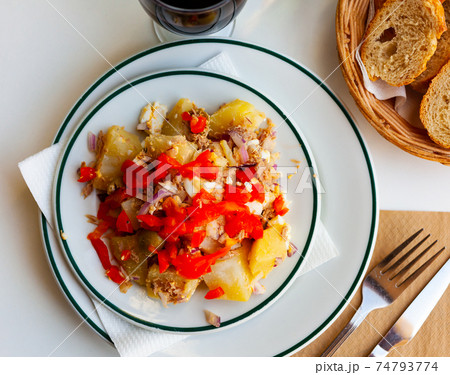 Salad with boiled potatoes, eggs, canned tuna, olives, bell peppers, onions Salad with boiled potatoes, eggs, canned tuna, olives, bell peppers, onions 74793774