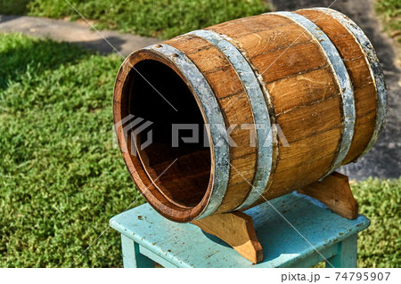Open wooden barrel dries in the sun after rinsing Open wooden barrel dries in the sun after rinsing 74795907