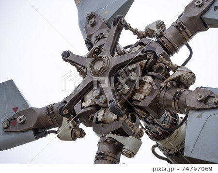 The mechanism of screws military helicopter on the background of blue sky, a close-up 74797069