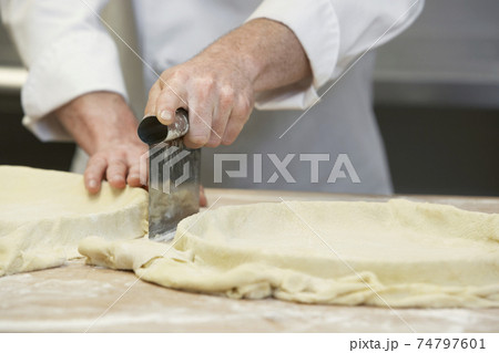 Chef Cutting Dough Chef Cutting Dough 74797601